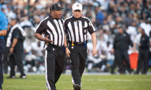 22 December 2013: Referee Walt Anderson (66) and field judge Buddy Horton (18) discuss a play before a review during the NFL game between the San Diego Chargers and the Oakland Raiders at Qualcomm Stadium in San Diego, CA. Photographer: Orlando Ramirez/ Icon Sportswire