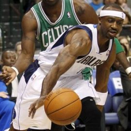 Mavericks guard Terry drives past Celtics forward Pietrus during their NBA basketball game in Dallas, Texas