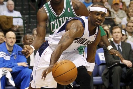 Mavericks guard Terry drives past Celtics forward Pietrus during their NBA basketball game in Dallas, Texas