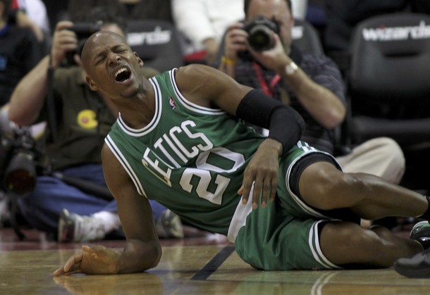 Boston Celtics' Ray Allen grimaces on the court in the first half of the NBA basketball game against the Washington Wizards