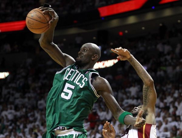 Celtics' Garnett fights for a rebound with Heat's Haslem in the fourth quarter during Game 7 of their Eastern Conference Finals NBA basketball playoffs in Miami