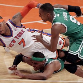 Boston Celtics Rajon Rondo watches New York Knicks Carmelo Anthony fall on Paul Pierce in the first half in the Eastern Conference first round of the NBA Playoffs at Madison Square Garden in New York City on April 22, 2011. The Celtics defeated the Knicks 113-96 and lead the series 3-0. UPI/John Angelillo