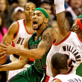 Jan 11, 2014; Portland, OR, USA; Boston Celtics point guard Jerryd Bayless (11) shoots over Portland Trail Blazers point guard Mo Williams (25) at the Moda Center. Mandatory Credit: Craig Mitchelldyer-USA TODAY Sports