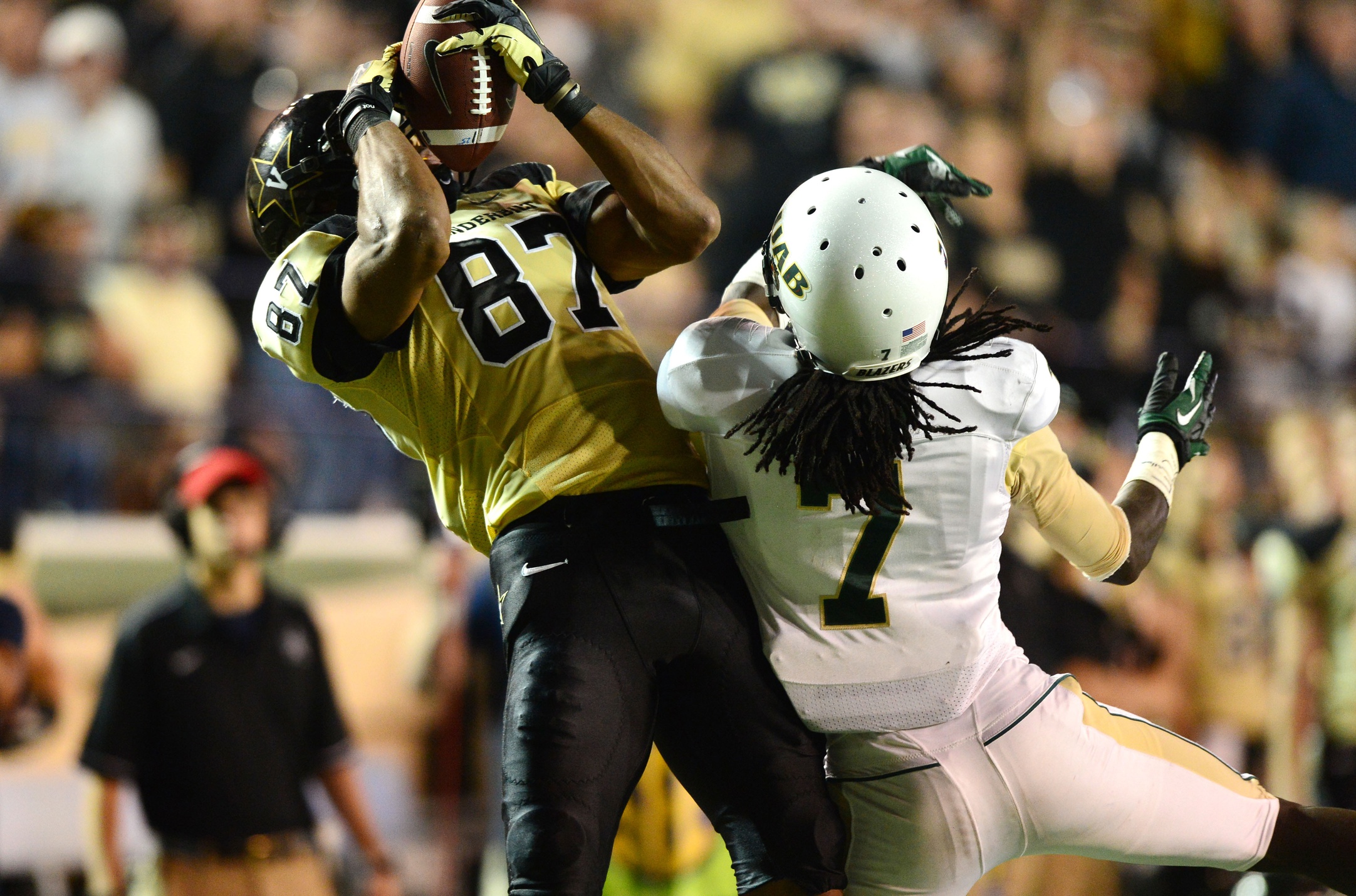 Sep 28, 2013; Nashville, TN, USA; Vanderbilt Commodores wide receiver Jordan Matthews (87) catches a touchdown pass against Alabama-Birmingham Blazers cornerback Jimmy Jean (7) during the second half at Vanderbilt Stadium. The Commodores beat the Blazers 52-24. Mandatory Credit: Don McPeak-USA TODAY Sports