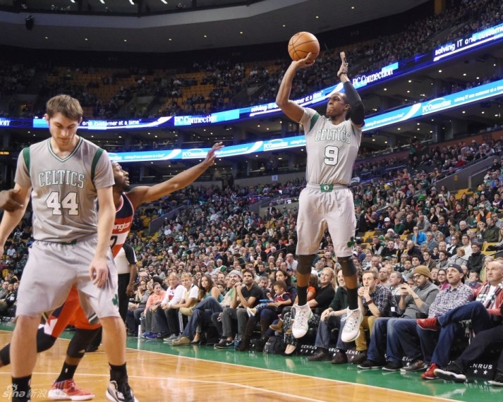 BOSTON, MA - DECEMBER 7: Rajon Rondo #9 of the Boston Celtics shoots against the Washington Wizards?uring the game on December 7, 2014 at TD Garden in Boston, Massachusetts. NOTE TO USER: User expressly acknowledges and agrees that, by downloading and or using this Photograph, user is consenting to the terms and conditions of the Getty Images License Agreement. Mandatory Copyright Notice: Copyright 2014 NBAE (Photo by Brian Babineau/NBAE via Getty Images)