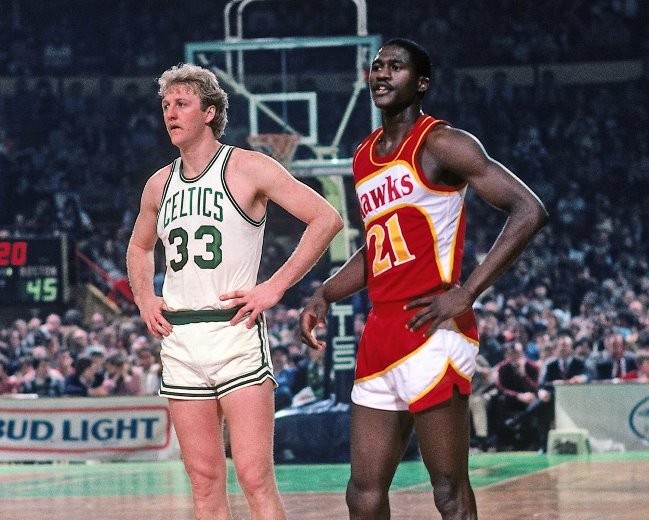 BOSTON - 1983: Dominique Wilkins #21 of the Atlanta Hawks and Larry Bird #33 of the Boston Celtics stand on the court during a game played in 1983 at the Boston Garden in Boston, Massachusetts. NOTE TO USER: User expressly acknowledges and agrees that, by downloading and or using this photograph, User is consenting to the terms and conditions of the Getty Images License Agreement. Mandatory Copyright Notice: Copyright 1983 NBAE (Photo by Dick Raphael/NBAE via Getty Images)