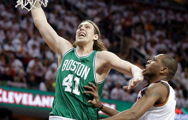 Boston Celtics' Kelly Olynyk (41) goes in for a dunk against Cleveland Cavaliers' James Jones in a first round NBA playoff basketball game Sunday, April 19, 2015, in Cleveland. (AP Photo/Mark Duncan)