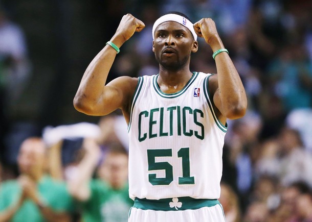 Boston Celtics' Dooling celebrates a teammate's basket against the Miami Heat during Game 3 of their Eastern Conference Finals NBA basketball playoffs in Boston