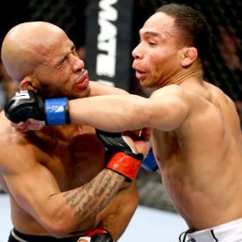 061714-UFC-John-Dodson-punches-Demetrious-Johnson-PI.vresize.1200.675.high.58