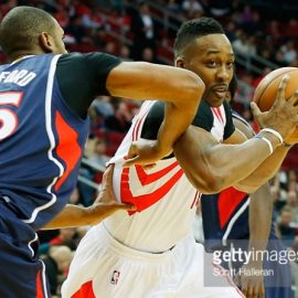 Dwight Howard #12 of the Houston Rockets battles for the basketball with Al Horford #15 of the Atlanta Hawks during their game at the Toyota Center on December 20, 2014 in Houston, Texas. *** Local Caption *** Dwight Howard; Al Horford