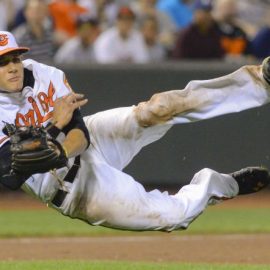 Baltimore Orioles third baseman Manny Machado makes a
      spectacular off balance throw to get New York Yankees batter
      Alfonso Soriano at first base during the ninth inning of
      their MLB American League baseball game in Baltimore