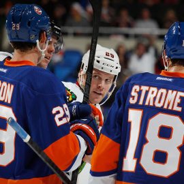 UNIONDALE, NY - JANUARY 02: Bryan Bickell #29 of the Chicago Blackhawks eyes Brock Nelson #29 and Ryan Strome #18 of the New York Islanders following a brief battle during the third period at the Nassau Veterans Memorial Coliseum on January 2, 2014 in Uniondale, New York. The Islanders defeated the Blackhawks 3-2 in overtime. (Photo by Bruce Bennett/Getty Images)