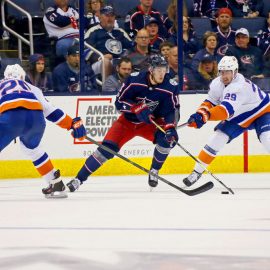 COLUMBUS, OH - OCTOBER 6: Pierre-Luc Dubois #18 of the Columbus Blue Jackets attempts to skate the puck past Jason Chimera #25 of the New York Islanders and Brock Nelson #29 of the New York Islanders during the third period on October 6, 2017 at Nationwide Arena in Columbus, Ohio. Columbus defeated New York 5-0. (Photo by Kirk Irwin/Getty Images)