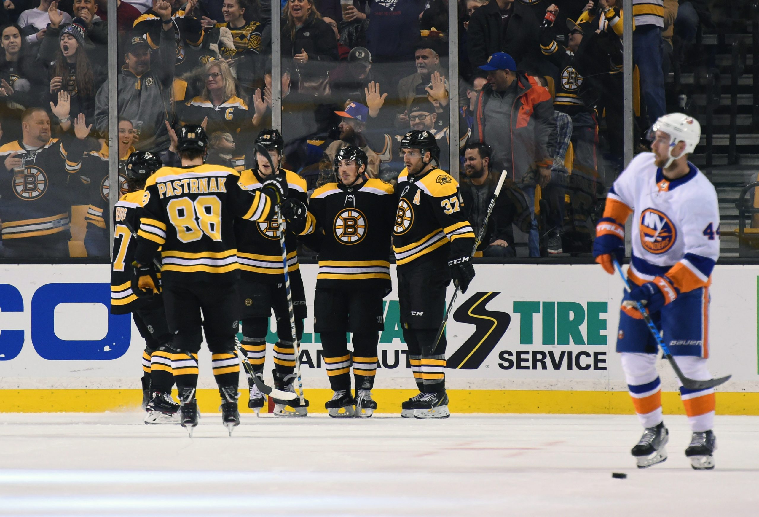 Dec 9, 2017; Boston, MA, USA; Boston Bruins left wing Brad Marchand (63) celebrates with teammates after scoring a goal against the New York Islanders during the second period at TD Garden. Mandatory Credit: Bob DeChiara-USA TODAY Sports