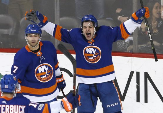Dec 16, 2017; Brooklyn, NY, USA; New York Islanders center Jordan Eberle (7) and New York Islanders center Mathew Barzal (13) celebrate after defeating the Los Angeles Kings 4-3 in overtime at Barclays Center. Mandatory Credit: Noah K. Murray-USA TODAY Sports