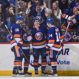 Dec 23, 2017; Brooklyn, NY, USA; New York Islanders center Mathew Barzal (13) celebrates his first hat trick during the third period between the New York Islanders and the Winnipeg Jets at Barclays Center. Mandatory Credit: Dennis Schneidler-USA TODAY Sports