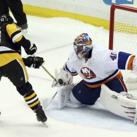 Mar 24, 2017; Pittsburgh, PA, USA; New York Islanders goalie Jaroslav Halak (41) makes a save against Pittsburgh Penguins center Nick Bonino (13) to preserve a shootout win at the PPG PAINTS Arena. The Islanders won 4-3 in a shootout. Mandatory Credit: Charles LeClaire-USA TODAY Sports