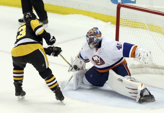 Mar 24, 2017; Pittsburgh, PA, USA; New York Islanders goalie Jaroslav Halak (41) makes a save against Pittsburgh Penguins center Nick Bonino (13) to preserve a shootout win at the PPG PAINTS Arena. The Islanders won 4-3 in a shootout. Mandatory Credit: Charles LeClaire-USA TODAY Sports