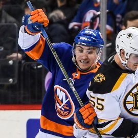 Jan 18, 2018; Brooklyn, NY, USA; New York Islanders left wing Michael Dal Colle (71) and Boston Bruins center Noel Acciari (55) battle for the puck during the second period at Barclays Center. Mandatory Credit: Dennis Schneidler-USA TODAY Sports