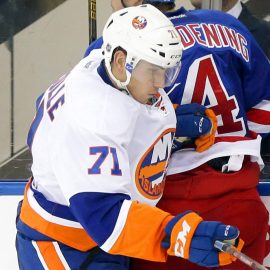 Sep 27, 2016; New York, NY, USA; New York Rangers defenseman Adam Clendening (4) and New York Islanders left wing Michael Dal Colle (71) come together at the boards during the second period during a preseason hockey game at Madison Square Garden. Mandatory Credit: Andy Marlin-USA TODAY Sports