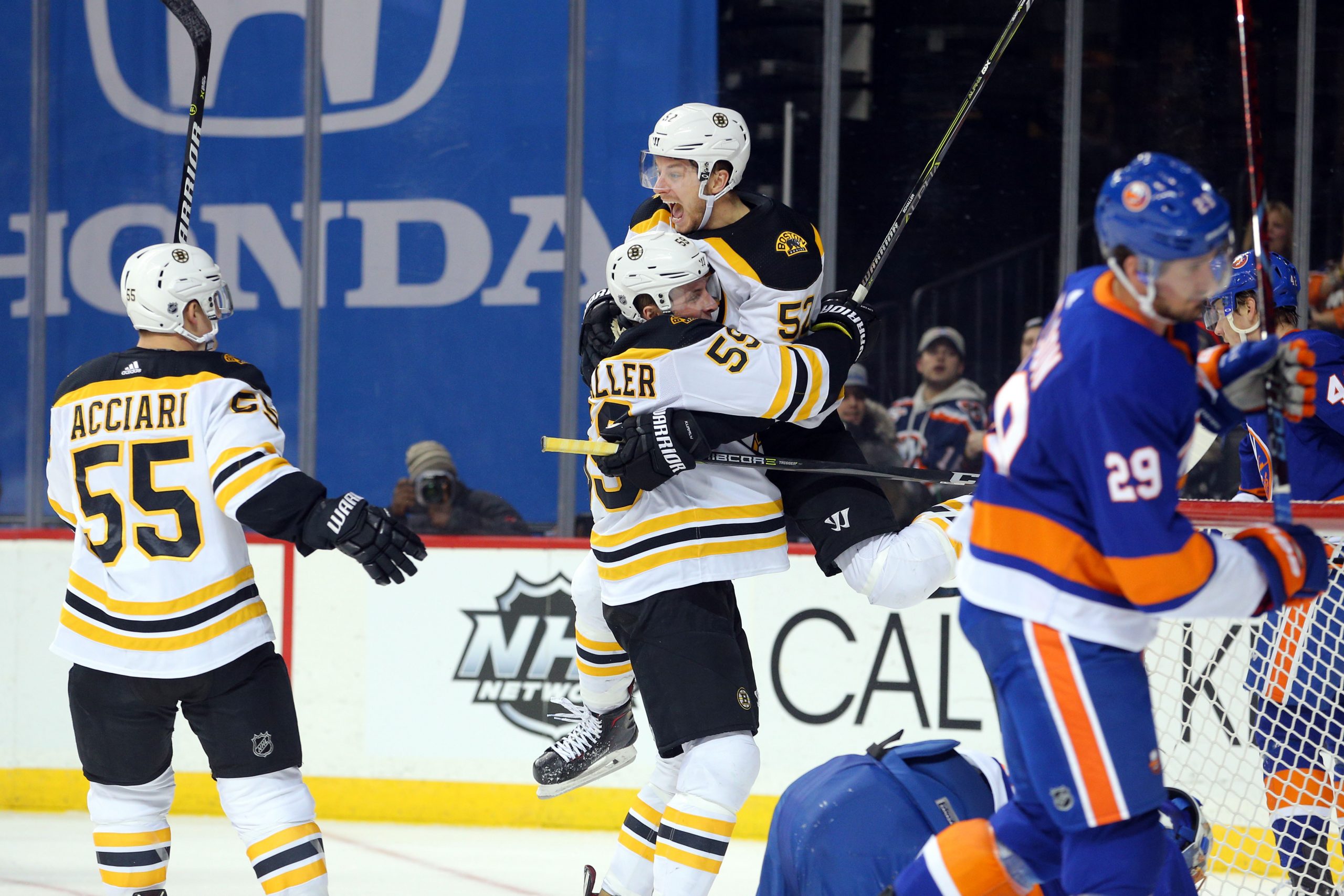 Jan 2, 2018; Brooklyn, NY, USA; Boston Bruins left wing Tim Schaller (59) celebrates his goal against the New York Islanders with Boston Bruins center Sean Kuraly (52) during the third period at Barclays Center. Mandatory Credit: Brad Penner-USA TODAY Sports