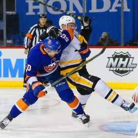 Jan 5, 2018; Brooklyn, NY, USA; New York Islanders defenseman Adam Pelech (50) and Pittsburgh Penguins right wing Patric Hornqvist (72) battle for position during the first period at Barclays Center. Mandatory Credit: Andy Marlin-USA TODAY Sports