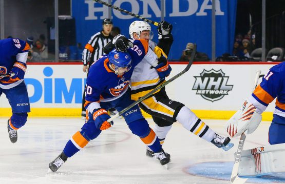 Jan 5, 2018; Brooklyn, NY, USA; New York Islanders defenseman Adam Pelech (50) and Pittsburgh Penguins right wing Patric Hornqvist (72) battle for position during the first period at Barclays Center. Mandatory Credit: Andy Marlin-USA TODAY Sports