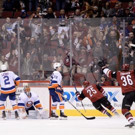 Jan 22, 2018; Glendale, AZ, USA; Arizona Coyotes center Nick Cousins (25) scores the game winning goal against New York Islanders goaltender Jaroslav Halak (41) in overtime at Gila River Arena. The Arizona Coyotes won 3-2 in overtime. Mandatory Credit: Jennifer Stewart-USA TODAY Sports