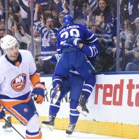 Jan 31, 2018; Toronto, Ontario, CAN; Toronto Maple Leafs forward William Nylander (29) jumps in celebration on defenceman Travis Dermott (23, obscured) after Dermott scored his first career NHL goal against New York Islanders i the second period at Air Canada Centre. Mandatory Credit: Dan Hamilton-USA TODAY Sports