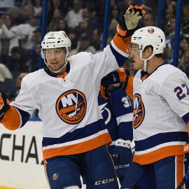 Nov 18, 2017; Tampa, FL, USA; New York Islanders right wing Josh Bailey (12) celebrates after New York Islanders left wing Anders Ladd (27) scored a goal in the first period in the first period against the Tampa Bay Lightning at Amalie Arena. Mandatory Credit: Jonathan Dyer-USA TODAY Sports