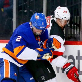 Jan 16, 2018; Brooklyn, NY, USA; New Jersey Devils right wing Stefan Noesen (23) and New York Islanders defenseman Nick Leddy (2) battle for position along the boards during the third period at Barclays Center. Mandatory Credit: Andy Marlin-USA TODAY Sports