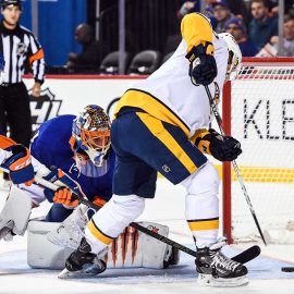 Feb 5, 2018; Brooklyn, NY, USA; Nashville Predators left wing Kevin Fiala (22) puts in a rebound against the New York Islanders during the first period at Barclays Center. Mandatory Credit: Dennis Schneidler-USA TODAY Sports