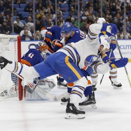 Feb 8, 2018; Buffalo, NY, USA; Buffalo Sabres center Ryan O'Reilly (90) dives to take a shot on goal during the second period against the New York Islanders at KeyBank Center. Mandatory Credit: Timothy T. Ludwig-USA TODAY Sports