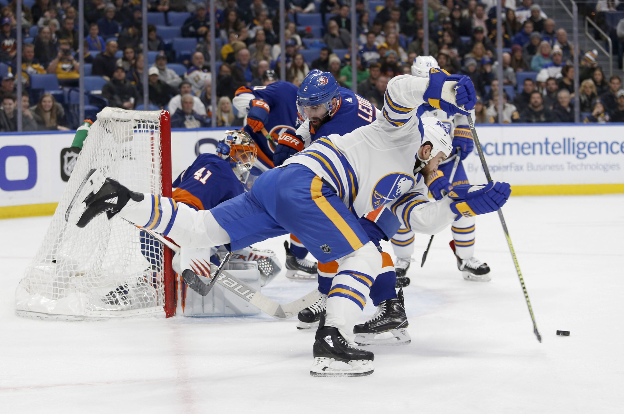 Feb 8, 2018; Buffalo, NY, USA; Buffalo Sabres center Ryan O'Reilly (90) dives to take a shot on goal during the second period against the New York Islanders at KeyBank Center. Mandatory Credit: Timothy T. Ludwig-USA TODAY Sports