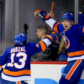 Feb 9, 2018; Brooklyn, NY, USA; New York Islanders center Brock Nelson (29) celebrates with center Mathew Barzal (13) after Nelson scored the game winning goal in overtime against the Detroit Red Wings at Barclays Center. Mandatory Credit: Andy Marlin-USA TODAY Sports