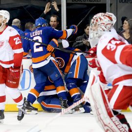 Feb 9, 2018; Brooklyn, NY, USA; New York Islanders center Brock Nelson (29) is congratulated after scoring the game winning goal in overtime as Detroit Red Wings goaltender Petr Mrazek (34) and defenseman Mike Green (25) skate away at Barclays Center. Mandatory Credit: Andy Marlin-USA TODAY Sports