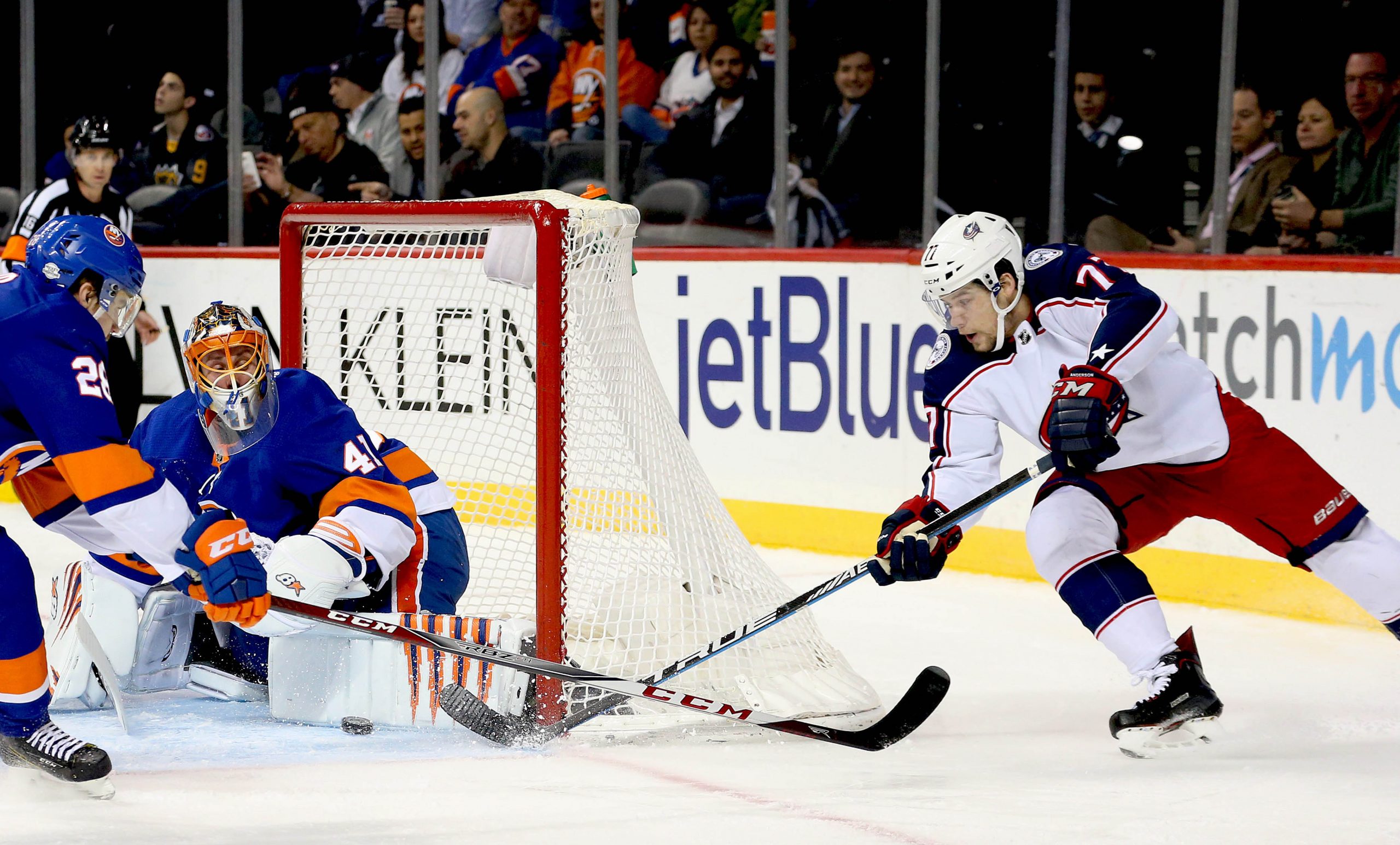 Feb 13, 2018; Brooklyn, NY, USA; New York Islanders goaltender Jaroslav Halak (41) makes a save on a wrap around shot by Columbus Blue Jackets right wing Josh Anderson (77) during the first period at Barclays Center. Mandatory Credit: Andy Marlin-USA TODAY Sports