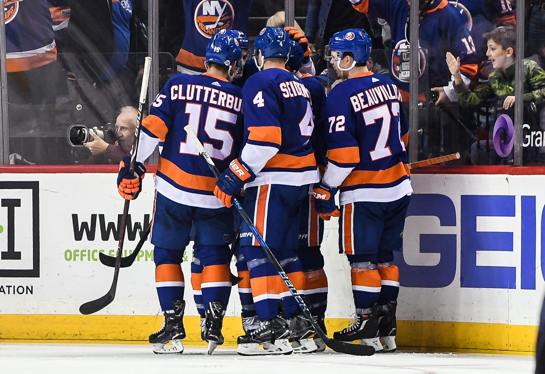 Feb 15, 2018; Brooklyn, NY, USA; New York Islanders celebrate the goal of New York Islanders defenseman Thomas Hickey (14) against the New York Rangers to make it 3-0 during the third period at Barclays Center. Mandatory Credit: Dennis Schneidler-USA TODAY Sports