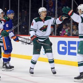 Feb 19, 2018; Brooklyn, NY, USA; Minnesota Wild center Joel Eriksson Ek (14) celebrates his goal against the New York Islanders with center Charlie Coyle (3) and left wing Tyler Ennis (63) during the first period at Barclays Center. Mandatory Credit: Brad Penner-USA TODAY Sports
