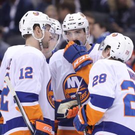 Feb 22, 2018; Toronto, Ontario, CAN; New York Islanders center John Tavares (91) talks to right wing Josh Bailey (12) against the Toronto Maple Leafs at Air Canada Centre. The Maple Leafs beat the Islanders 4-3 in a shootout. Mandatory Credit: Tom Szczerbowski-USA TODAY Sports