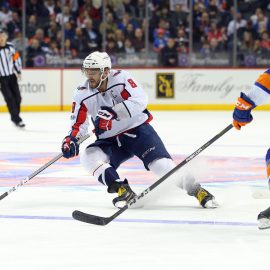 Dec 11, 2017; Brooklyn, NY, USA; Washington Capitals left wing Alex Ovechkin (8) plays the puck against New York Islanders defenseman Ryan Pulock (6) during the third period at Barclays Center. Mandatory Credit: Brad Penner-USA TODAY Sports