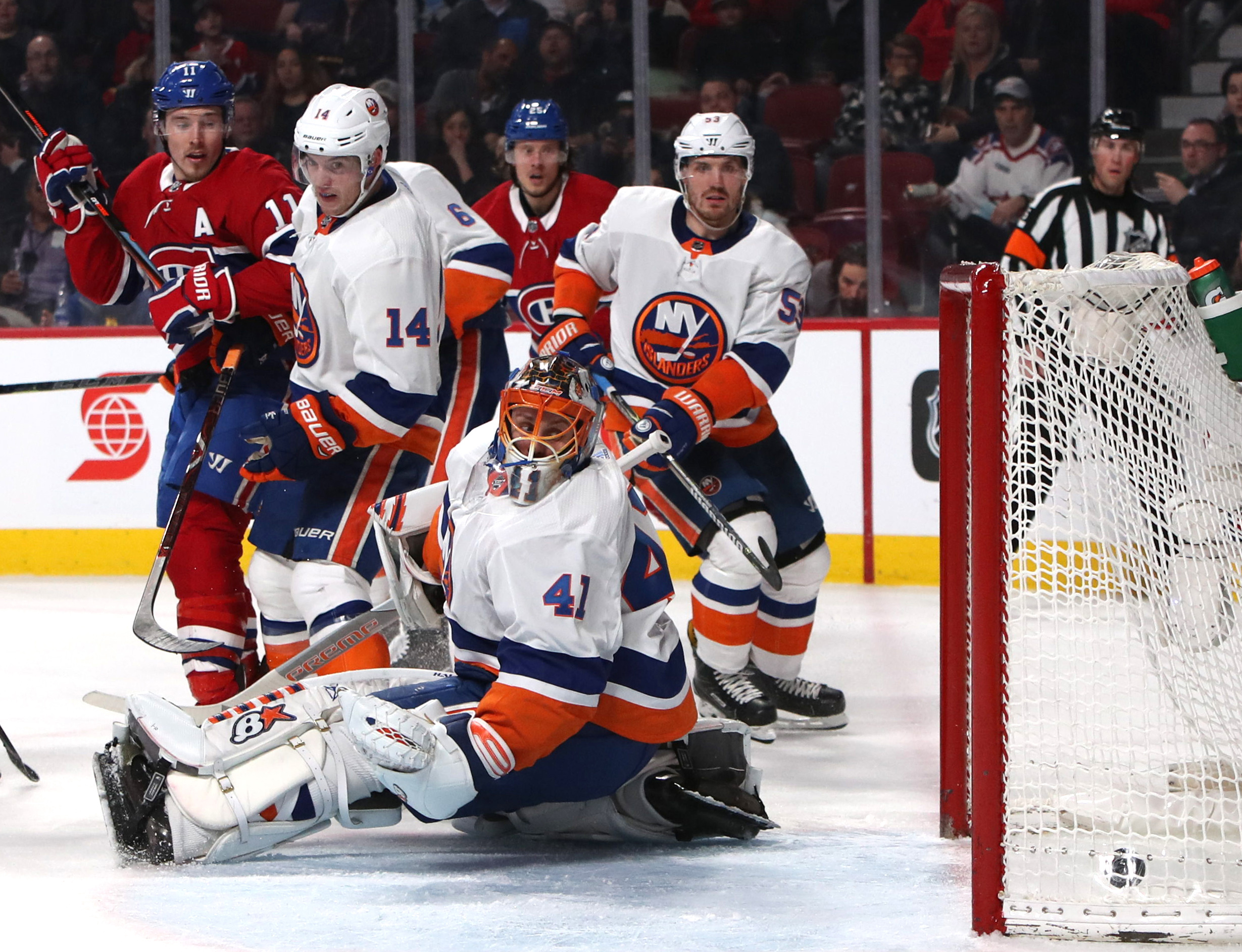 Feb 28, 2018; Montreal, Quebec, CAN; Montreal Canadiens right wing Nikita Scherbak (38) (not pictured) scores a goal against New York Islanders goaltender Jaroslav Halak (41) and defenseman Thomas Hickey (14) defends during the second period at Bell Centre. Mandatory Credit: Jean-Yves Ahern-USA TODAY Sports