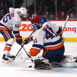 Feb 28, 2018; Montreal, Quebec, CAN; New York Islanders goaltender Jaroslav Halak (41) makes a save against Montreal Canadiens left wing Alex Galchenyuk (27) as defenseman Johnny Boychuk (55) defends during the second period at Bell Centre. Mandatory Credit: Jean-Yves Ahern-USA TODAY Sports
