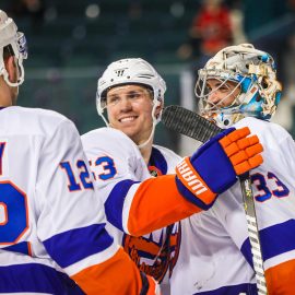 Mar 11, 2018; Calgary, Alberta, CAN; New York Islanders goaltender Christopher Gibson (33) celebrate with teammates after defeating the Calgary Flames at Scotiabank Saddledome. Mandatory Credit: Sergei Belski-USA TODAY Sports