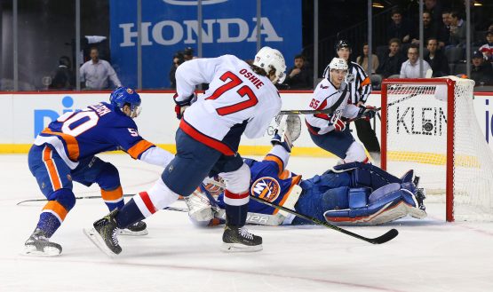 Mar 15, 2018; Brooklyn, NY, USA; Washington Capitals right wing T.J. Oshie (77) scores a goal a against the New York Islanders during the first period at Barclays Center. Mandatory Credit: Andy Marlin-USA TODAY Sports