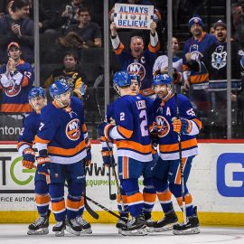 Mar 20, 2018; Brooklyn, NY, USA; New York Islanders celebrate the goal by New York Islanders center Mathew Barzal (13) against the Pittsburgh Penguins during the first period at Barclays Center. Mandatory Credit: Dennis Schneidler-USA TODAY Sports