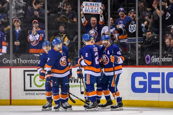 Mar 20, 2018; Brooklyn, NY, USA; New York Islanders celebrate the goal by New York Islanders center Mathew Barzal (13) against the Pittsburgh Penguins during the first period at Barclays Center. Mandatory Credit: Dennis Schneidler-USA TODAY Sports