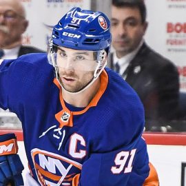 Mar 2, 2018; Brooklyn, NY, USA; New York Islanders center John Tavares (91) skates with the puck defended by Montreal Canadiens right wing Andrew Shaw (65) during the third period at Barclays Center. Mandatory Credit: Dennis Schneidler-USA TODAY Sports