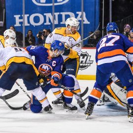 Feb 5, 2018; Brooklyn, NY, USA; Nashville Predators goaltender Pekka Rinne (35) makes a save as Nashville Predators defenseman Roman Josi (59) attempts to stop New York Islanders center John Tavares (91) from putting in a rebound during the second period at Barclays Center. Mandatory Credit: Dennis Schneidler-USA TODAY Sports