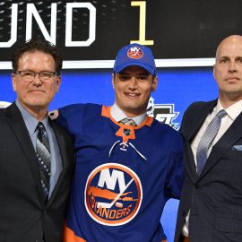 Jun 22, 2018; Dallas, TX, USA; Oliver Wahlstrom poses for a photo with team representatives after being selected as the number eleven overall pick to the New York Islanders in the first round of the 2018 NHL Draft at American Airlines Center. Mandatory Credit: Jerome Miron-USA TODAY Sports